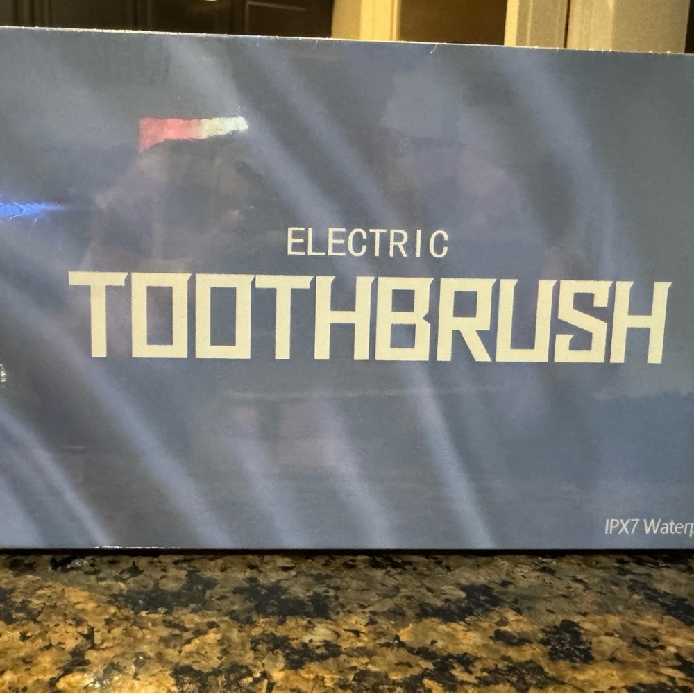 Electric Toothbrush in Blue Packaging